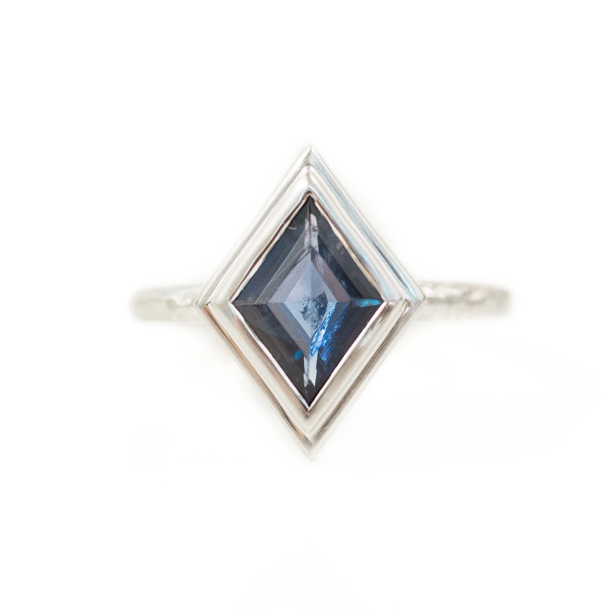 Kite Shaped Purple Blue Iolite in Evergreen Carved 18k White Bezel with satin finish